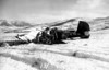 Pechner > This is the wreckage of a Navy TBM torpedo bomber of WW II vintage, at the Hagaru-ri airstrip. It was borrowed by Marine Observation Squadron 6 ( VMO-6), and their pilots used it to resupply and evacuate wounded from the emergency air strips at Hagaru-ri and Koto-ri near the Chosin Reservoir N. Korea, before the strips were made long enough to accomodate the larger R4D and C-47 transport aircraft. I don't know the details of its demise.
Bill Brennen, USMC, Hq. Sq. M.A.G. 33 1949-1951 billnm@sbcglobal.net